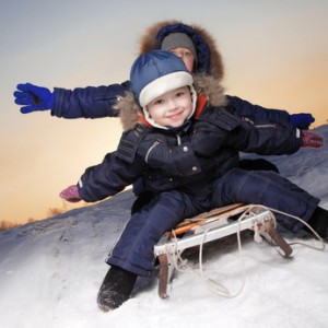 happy boys on sled